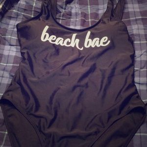 Black one piece suit with logo